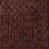 Brown leather texture with a quilted rectangular grid pattern, displaying natural grain and a matte, distressed finish.